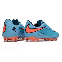Botas de fútbol Nike Phantom Hypervenom Elite azules y naranjas para terreno firme (FG).
