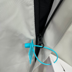 Chaqueta cortavientos Nike negra y gris