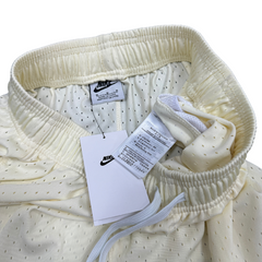 Pantalones cortos Nike color beige y rojo