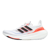 Scarpe da corsa Adidas Ultraboost Light bianche e arancioni